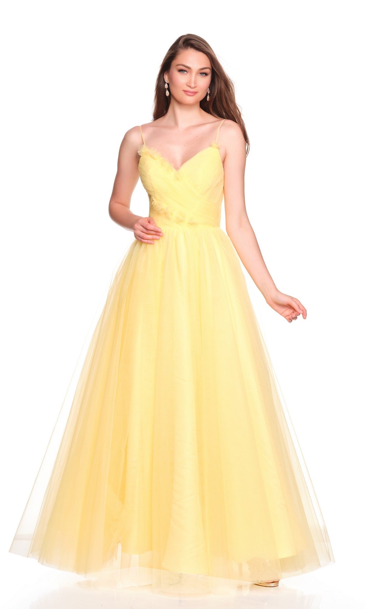 A woman models the Dave and Johnny 12580 long prom dress with a yellow chiffon bodice, thin straps, and a flowing tulle A-line skirt, set against a plain white background.
